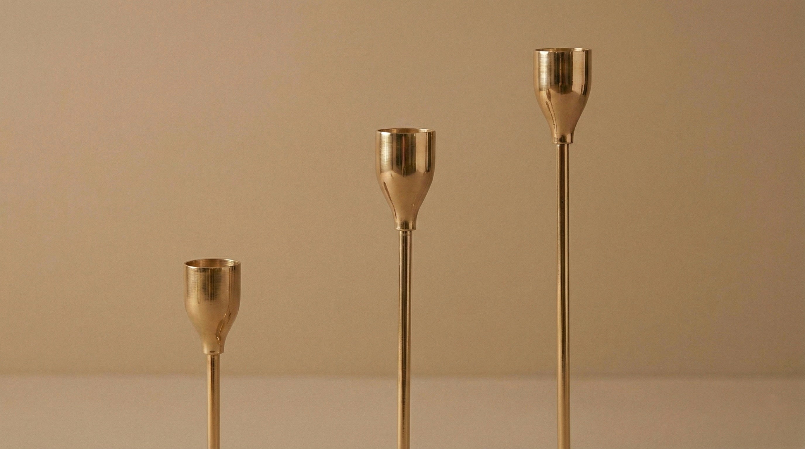 THREE GOLD METAL TAPER HOLDERS SET