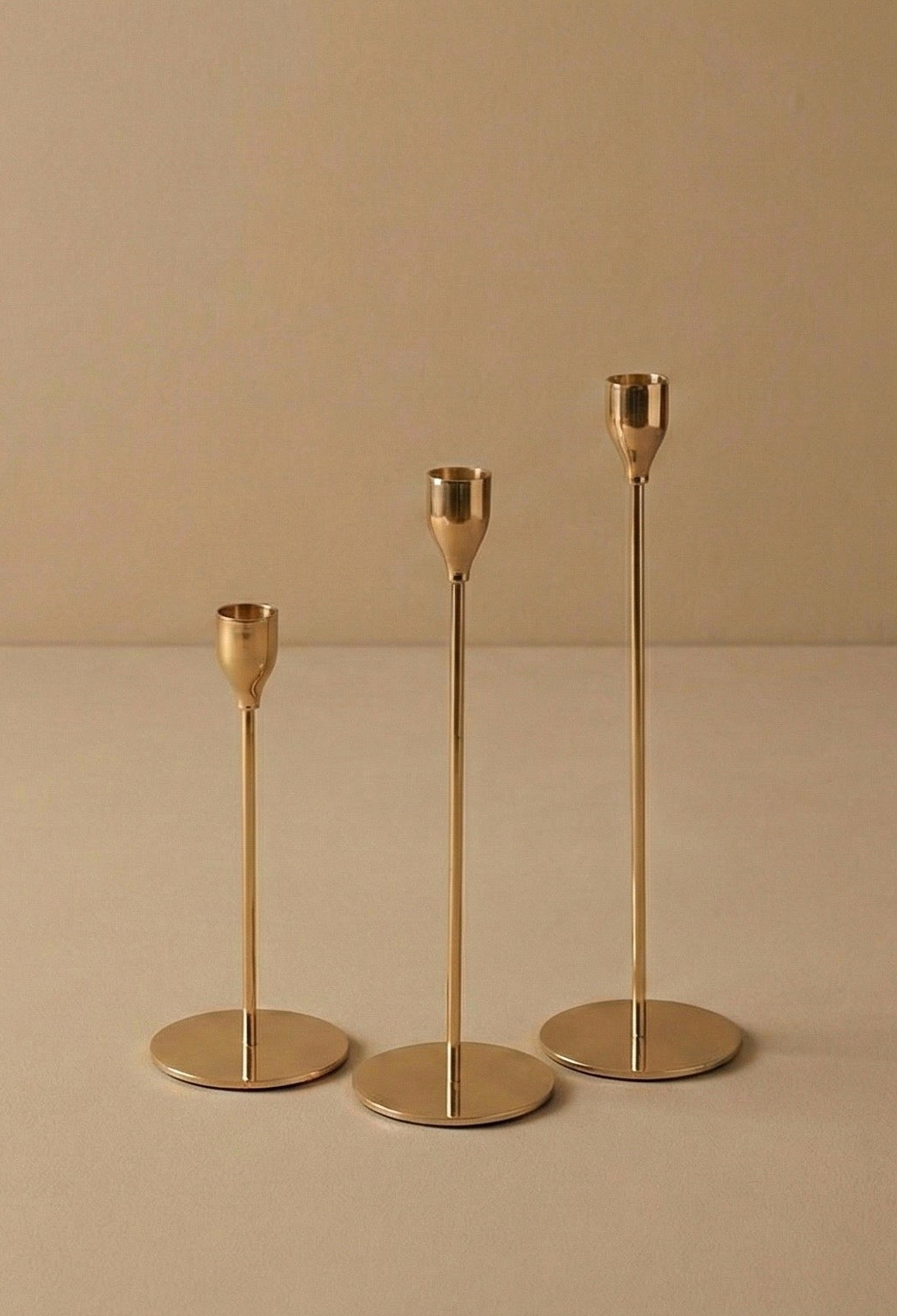 THREE GOLD METAL TAPER HOLDERS SET